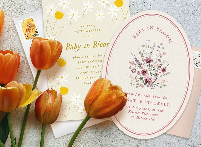 2 baby in bloom invitations and a few orange tulips