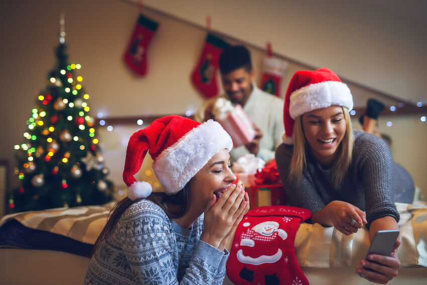 2 women looking at a phone