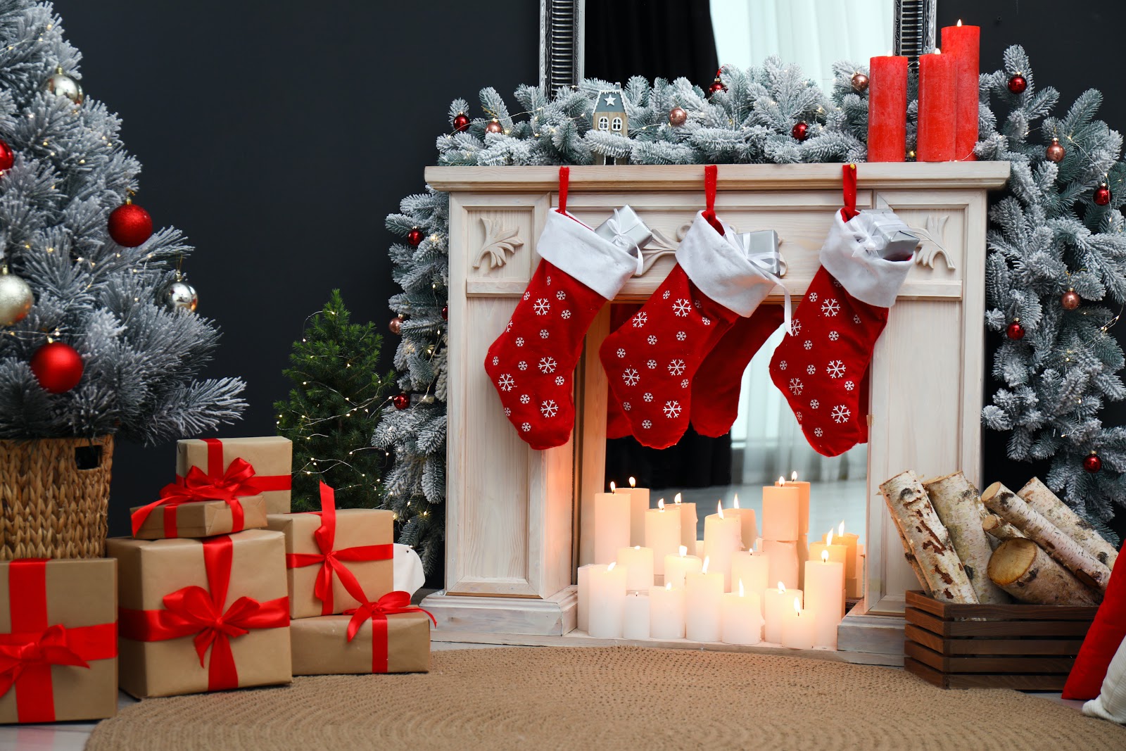 Christmas decorating ideas: A DIY fireplace made with a mirror, wooden mantel, and candles