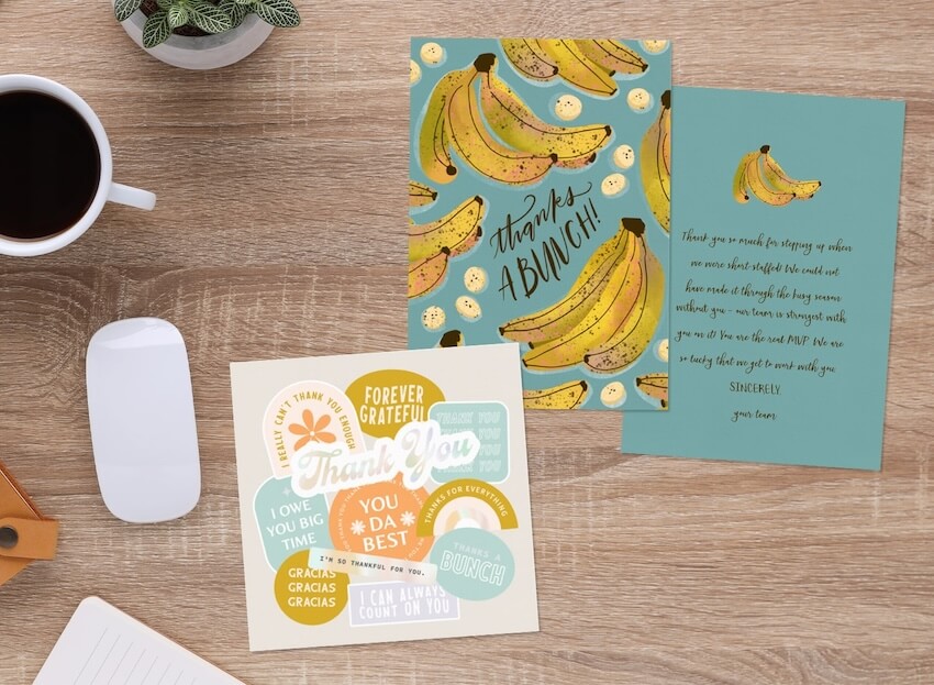 Thank you notes for coworkers: Greenvelope's Thanks a Bunch Card and the Vintage Stickers Card on a table