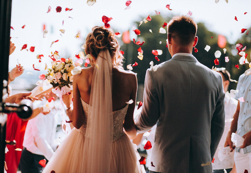 Wedding after party: back view of a bride and a groom