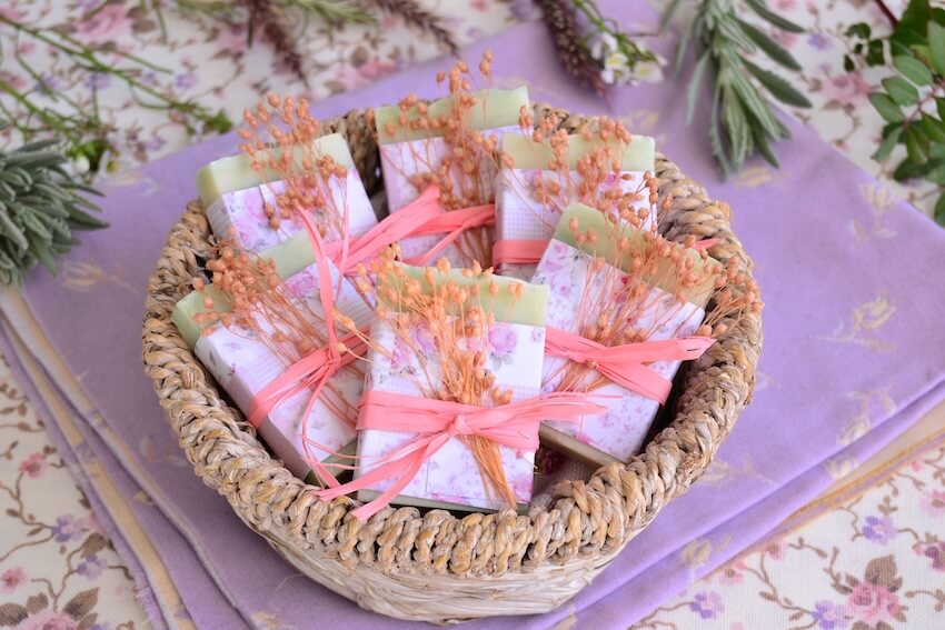 Baby in bloom baby shower: bar soaps with pink ribbons in a basket