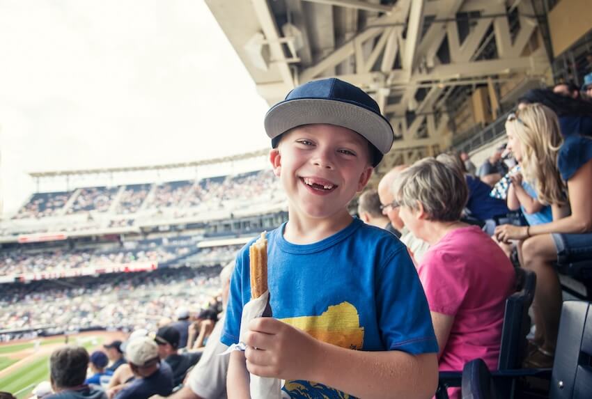 Baseball birthday party: boy smiling at the camera