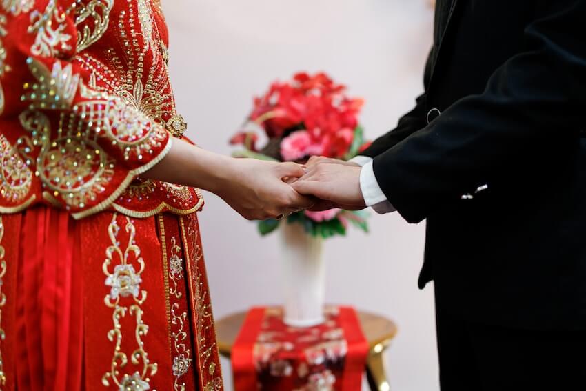 Bride and groom holding hands