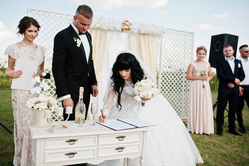 Bride signing a contract