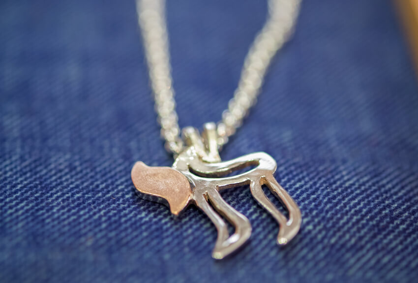 Close up shot of a chai necklace