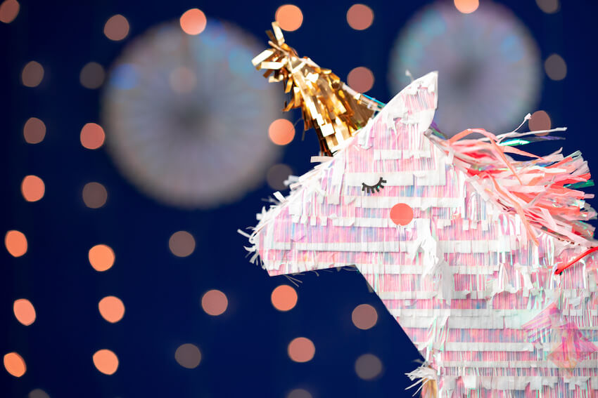 Unicorn birthday decorations: close up shot of a unicorn-shaped piñata