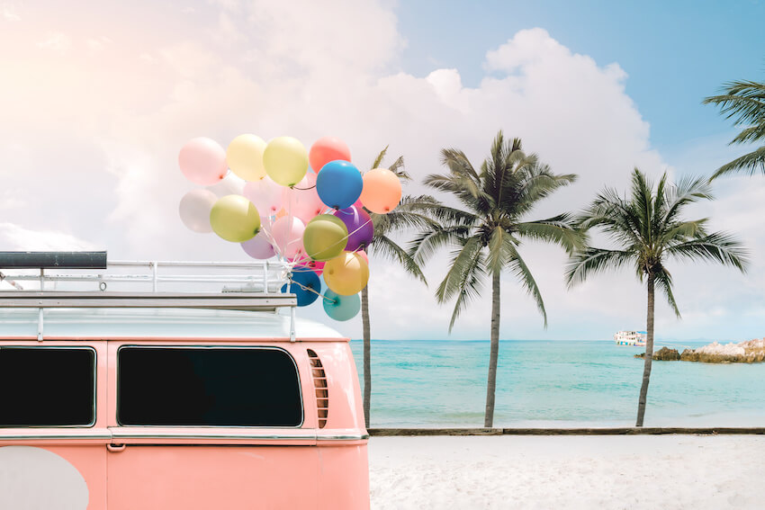 Colorful balloons tied to a car