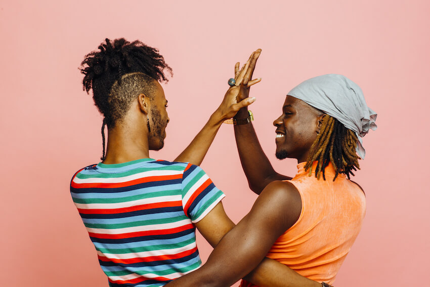 Couple high-fiving each other