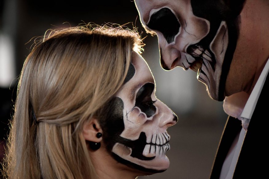 Halloween wedding ideas: couple with skull face paint