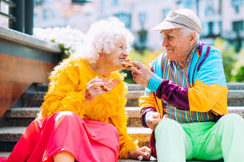 Cute senior couple eating together