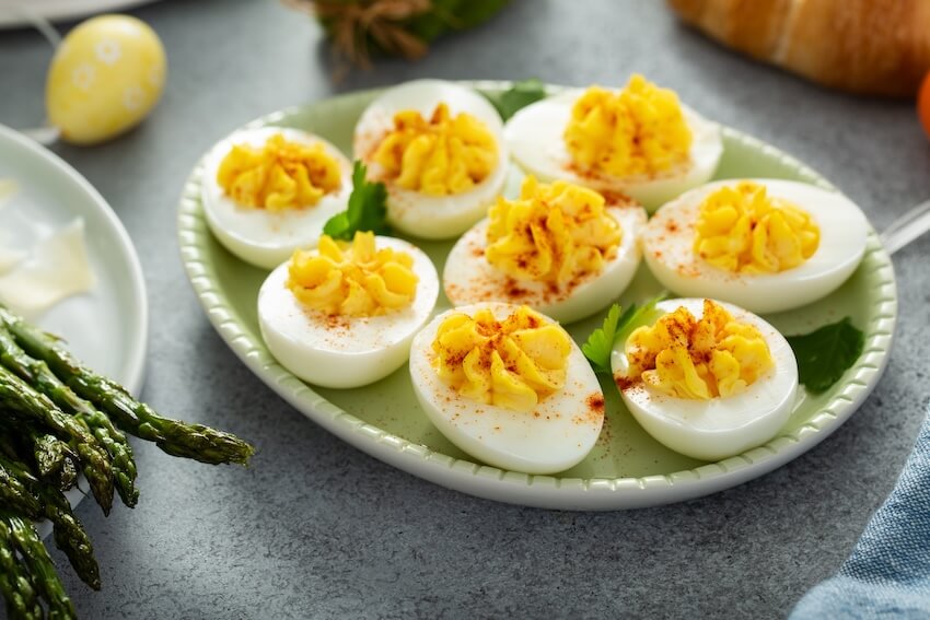Deviled eggs with paprika on a plate