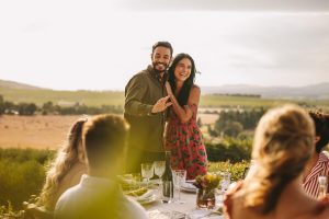 Couple celebrates with friends with a vineyard engagement party theme