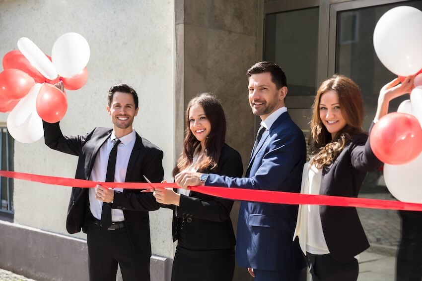 Entrepreneur cutting a ribbon