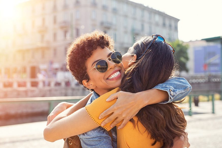 Wishing you the best: friends hugging each other