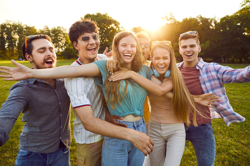 Farewell party: group of friends doing a group hug