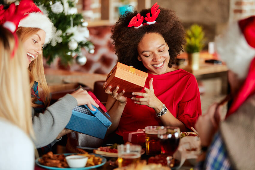 Group of friends exchanging gifts