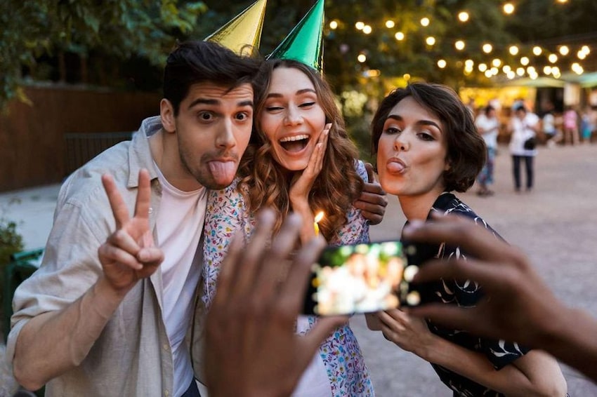 College party themes: group of friends posing for a photo
