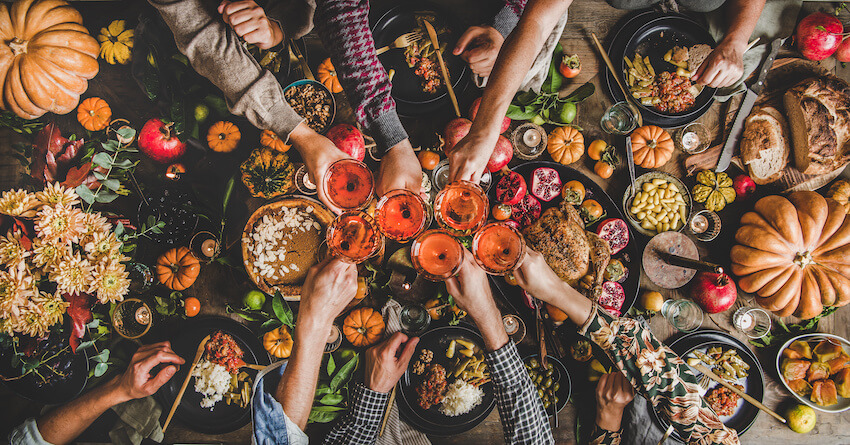 Thanksgiving potluck: group of people having a toast