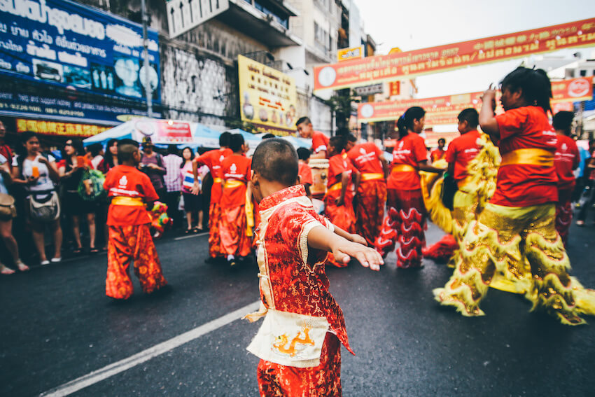 Happy Lunar New Year: group of people performing the Lion dance