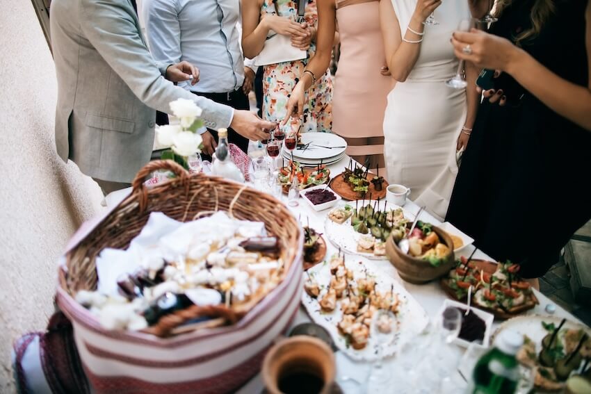 Guests eating snacks at a wedding reception