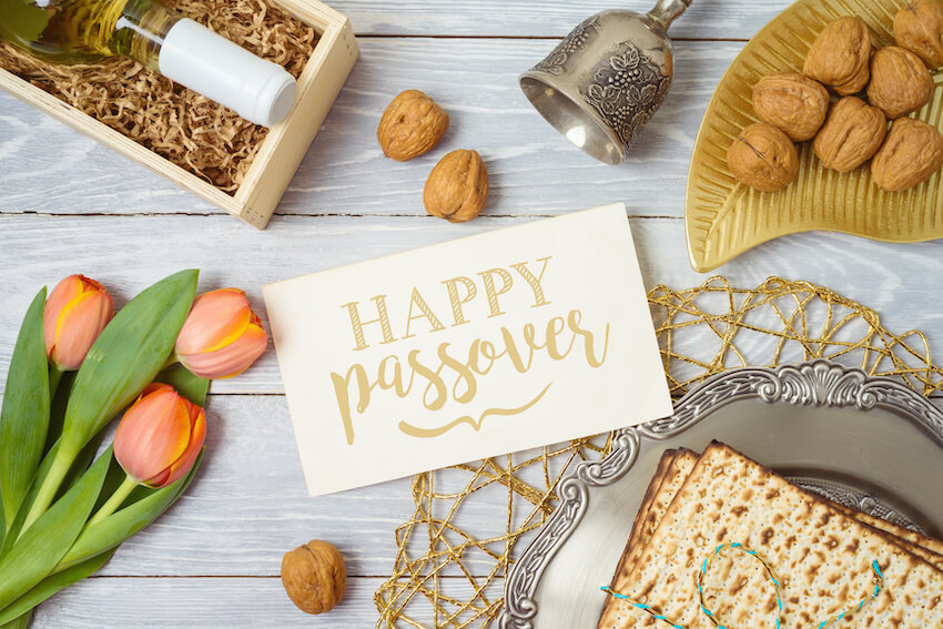 Happy Passover card surrounded by tulips and matzo