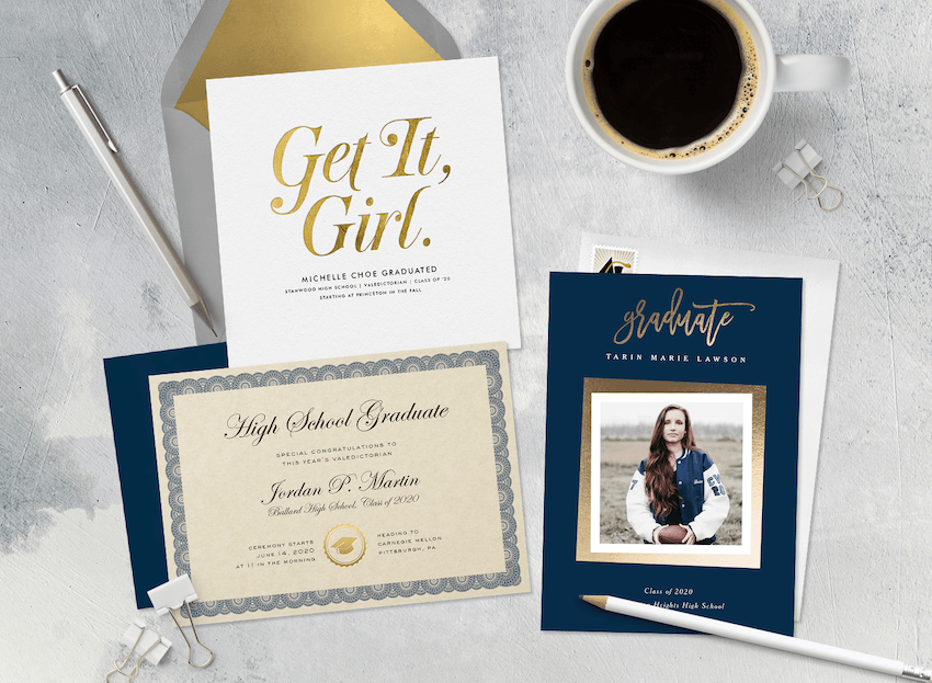 Two high school graduation announcements, a diploma, and a cup of coffee