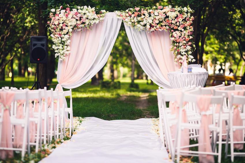 Garden wedding aisle with pink and white motif