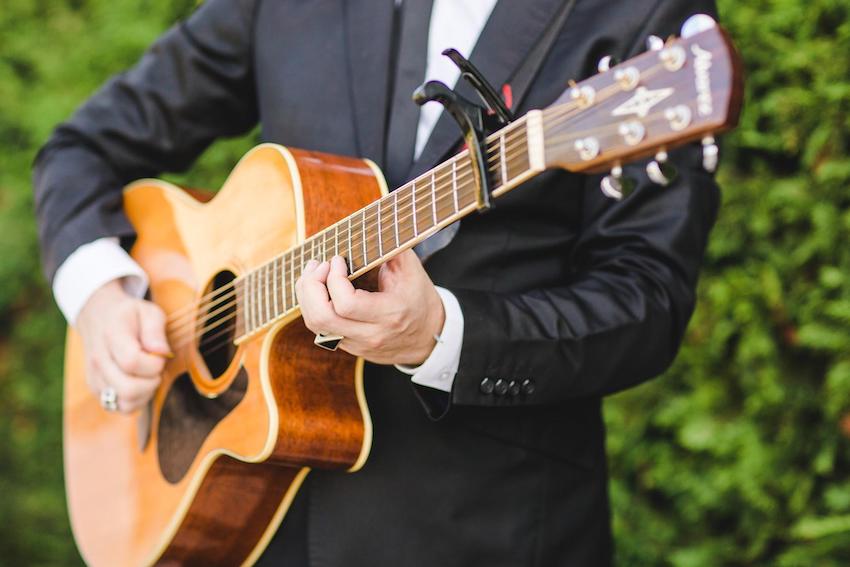 Micro wedding: person playing a guitar