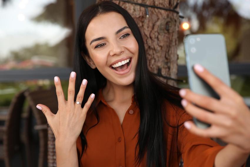 engagement announcement: woman showing her ring