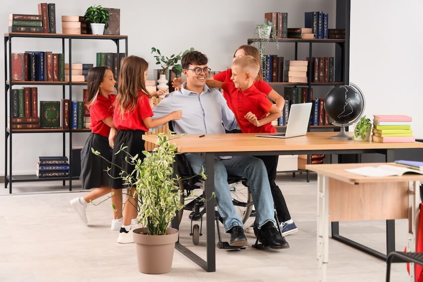 Teacher birthday: kids hugging their teacher