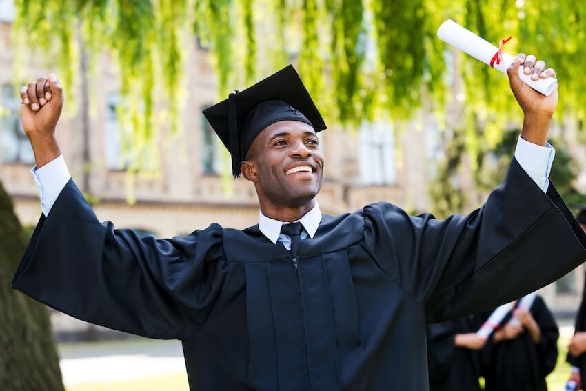 Graduation announcement cards: male graduate holding his diploma