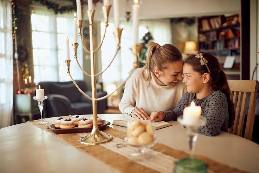 Hanukkah cards: mother and daughter reading a book