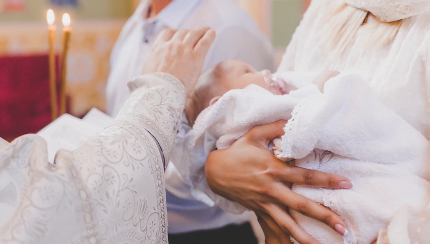 Baptism invitations girl: mother carrying her baby while a father blesses her child