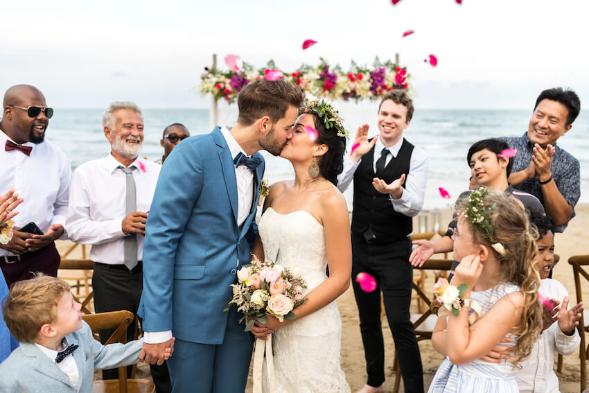 Newly married couple kissing
