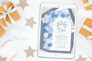 Balloon Arch Invitation on a tablet screen, small gifts, and star decorations