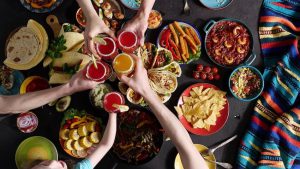 Fiesta invitations: people clinking their glasses