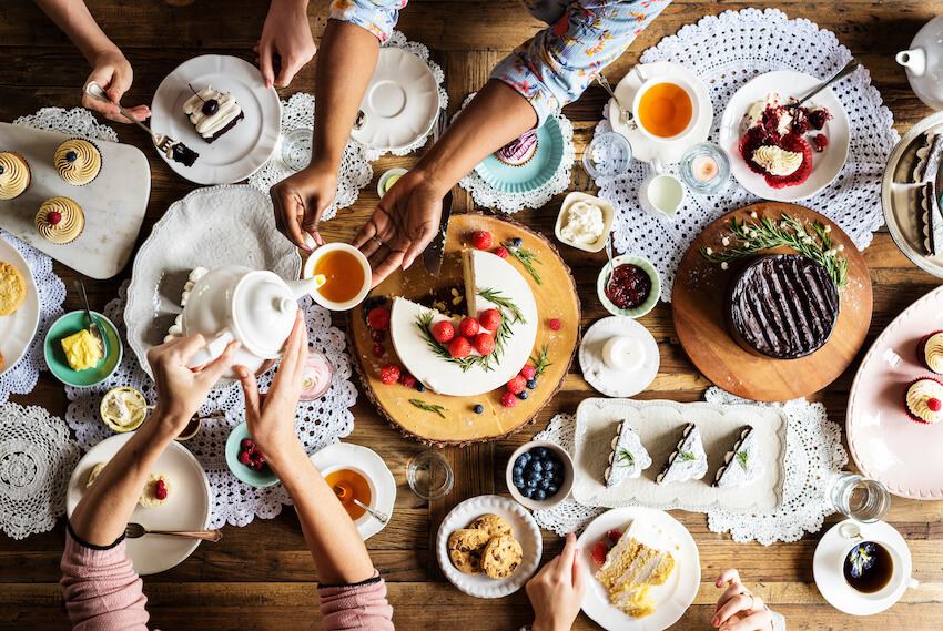 Tea party baby shower: person pouring tea from a small teapot