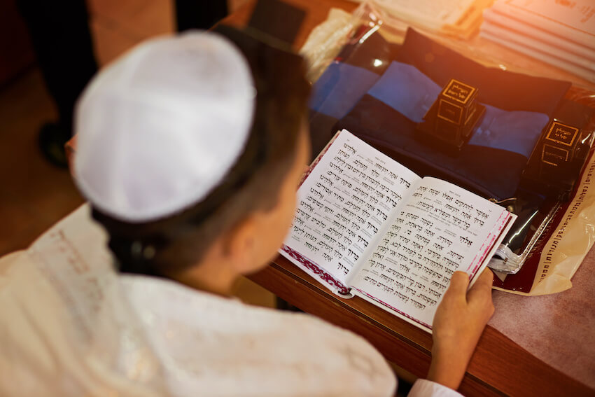 Bar mitzvah gifts: person reading the Torah