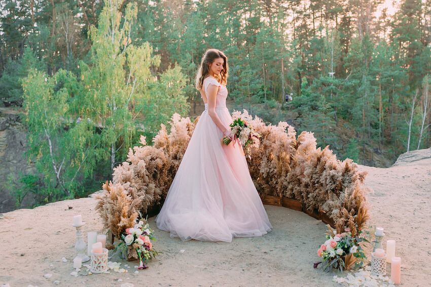 Fairy wedding: portrait of a bride holding a bouquet