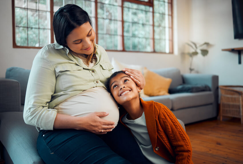 Pregnant mother and her daughter