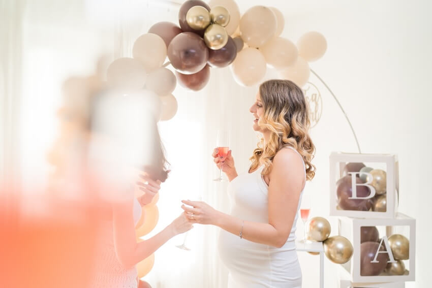 Pregnant woman talking to her guest