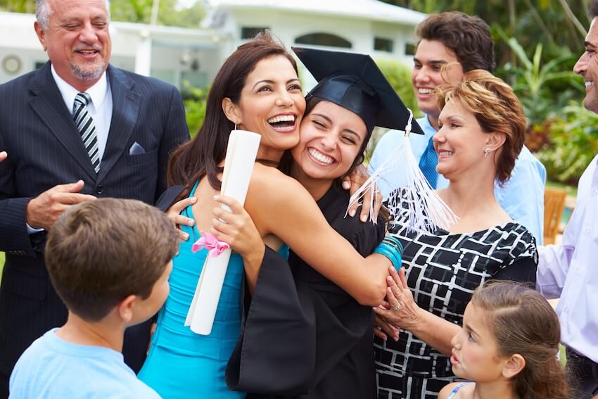 Graduation invitation wording: proud mother hugging her daughter