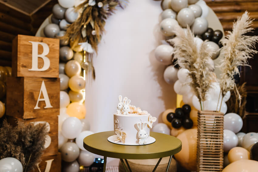 Boho baby shower: rabbit themed cake on a table