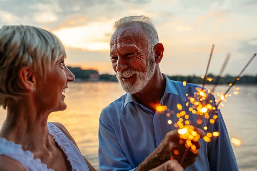 50th wedding anniversary gifts: senior couple holding some sparklers