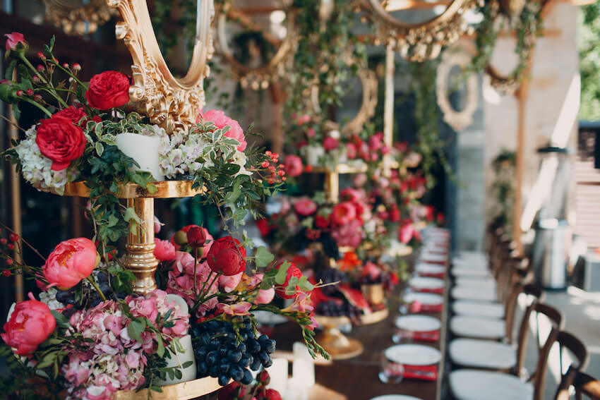 Table setting with flowers, berries, and plates