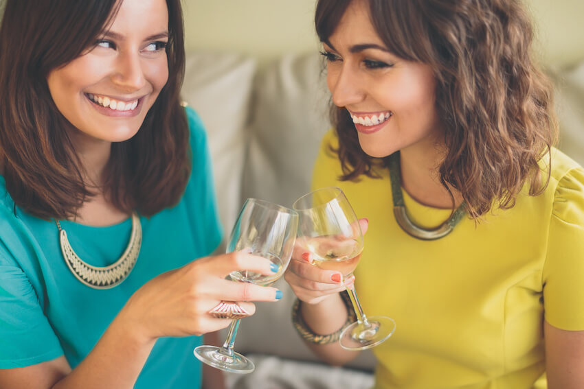 Two women happily having a toast