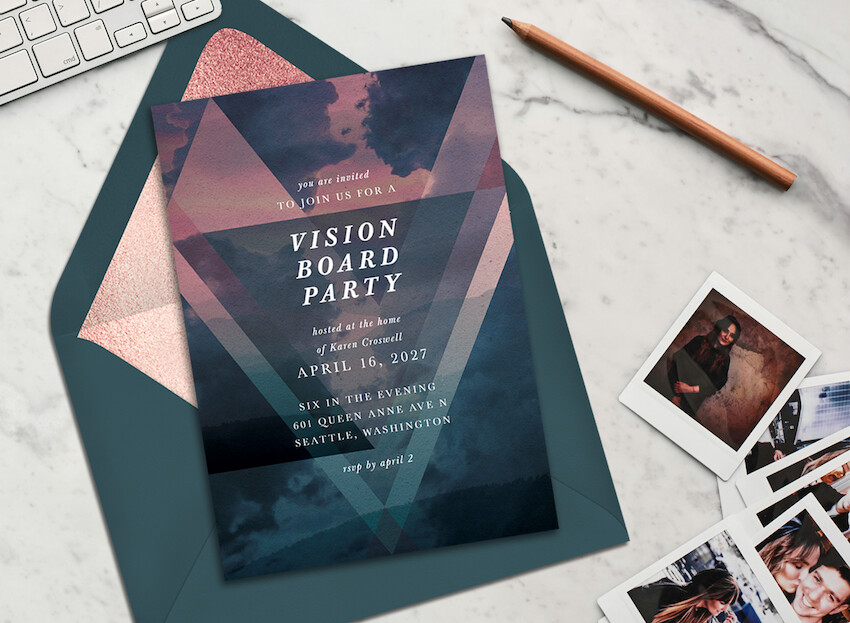 Vision board party ideas: vision board party invitation, a pencil, and some photos on the side