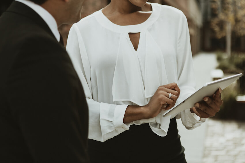 Wedding budget breakdown: wedding planner using a tablet