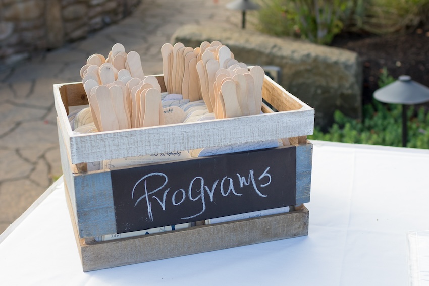 Wooden box labeled with the word "Programs"